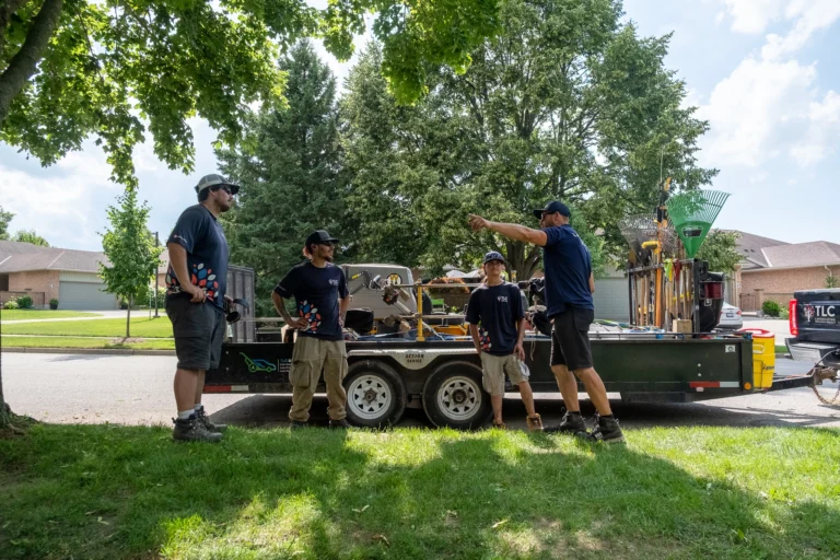 A tree care crew in front of a luscious lawn, used in Granum's blog post on Scaling Residential Tree Care Business Winter Playbook