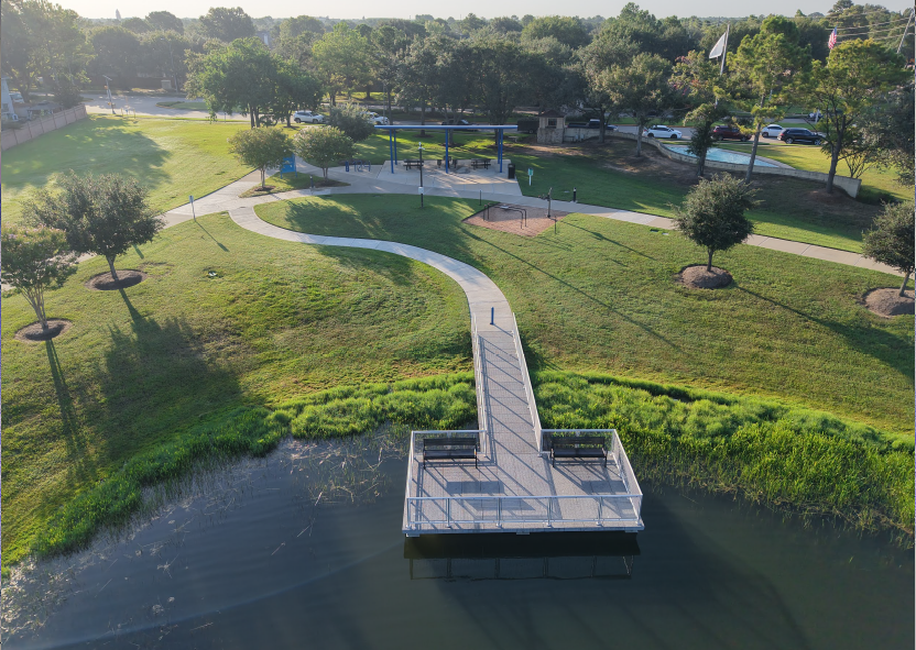 Aerial shot of a beautifully landscaped area with water. 